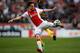 AMSTERDAM, NETHERLANDS - MARCH 09: Daley Blind of Ajax clears the ball away from Elvis Manu of Cambuur during the Eredivisie match between Ajax Amsterdam and SC Cambuur Leeuwarden at Amsterdam Arena on March 9, 2014 in Amsterdam, Netherlands. (Photo by