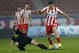 ATHENS,GREECE - JANUARY 18: Kostas Manolas of Olympiacos dribbles past Pedro Sass Petrazzi of Levadiakos with the ball during the Greek Superleague match between Olympiacos and Levadiakos at the Georgios Karaiskakis Stadium on January 18, 2014 in Athens