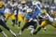NASHVILLE, TN - AUGUST 09: Bishop Sankey #20 of the Tennessee Titans runs with the ball in the second half of an NFL preseason game against the Green Bay Packers at LP Field on August 9, 2014 in Nashville, Tennessee. The Titans won 20-16. (Photo by Joe Ro