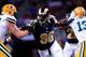 ST LOUIS, MO - AUGUST 16: Defensive end Michael Sam #96 of the St. Louis Rams in action during the preseason game against the Green Bay Packers at Edward Jones Dome on August 16, 2014 in St Louis, Missouri. (Photo by Jamie Squire/Getty Images)