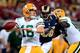 ST LOUIS, MO - AUGUST 16: Defensive end Michael Sam #96 of the St. Louis Rams persues quarterback Scott Tolzien #16 of the Green Bay Packers during the preseason game at Edward Jones Dome on August 16, 2014 in St Louis, Missouri. (Photo by Jamie Squire/