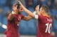 ROME, ITALY - JANUARY 12: Mehdi Benatia (L) with his team-mate Francesco Totti of AS Roma celebrates after scoring their fourth during the Serie A match between AS Roma and Genoa CFC at Stadio Olimpico on January 12, 2014 in Rome, Italy. (Photo by Paolo