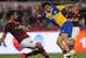 ROME, ITALY - APRIL 02: Amauri (L) of FC Parma competes for the ball with Mehdi Benatia of AS Roma during the Serie A match between AS Roma and FC Parma at Olimpico Stadium on April 2, 2014 in Rome, Italy. (Photo by Paolo Bruno/Getty Images)