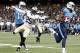 NEW ORLEANS, LA - AUGUST 15: Justin Hunter #15 of the Tennessee Titans runs in a pass for a touchdown in front of Rafael Bush #25 of the New Orleans Saints during a preseason game at the Mercedes-Benz Superdome on August 15, 2014 in New Orleans, Louisian