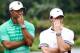 HAIKOU, CHINA - OCTOBER 28: Tiger Woods of the United States with Rory McIlroy of Northern Ireland react at Blackstone Course Mission Hills on October 28, 2013 in Haikou, China. (Photo by Lintao Zhang/Getty Images)