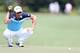GREENSBORO, NC - AUGUST 17: Camilo Villegas of Colombia lines up a putt on the first hole during the final round of the Wyndham Championship at Sedgefield Country Club on August 17, 2014 in Greensboro, North Carolina. (Photo by Todd Warshaw/Getty Images