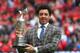 MANCHESTER, ENGLAND - AUGUST 16: Golfer Rory McIlroy of Northern Ireland poses with the Claret Jug at half-time during the Barclays Premier League match between Manchester United and Swansea City at Old Trafford on August 16, 2014 in Manchester, England.