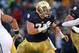 SOUTH BEND, IN - NOVEMBER 23: Matt Hegarty #77 of the Notre Dame Fighting Irish moves to block against the Brigham Young Cougars at Notre Dame Stadium on November 23, 2013 in South Bend, Indiana. Notre Dame defeated BYU 23-13. (Photo by Jonathan Daniel/Ge