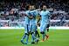 NEWCASTLE UPON TYNE, ENGLAND - AUGUST 17: Sergio Aguero of Manchester City celebrates with teammates David Silva (L) and Aleksandr Kolarov (R) celebrates after scoring his team's second goal during the Barclays Premier League match between Newcastle Unit