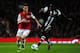 LONDON, ENGLAND - MARCH 12: Laurent Koscielny of Arsenal and Demba Ba of Newcastle battle for the ball during the Barclays Premier League match between Arsenal and Newcastle United at Emirates Stadium on March 12, 2012 in London, England. (Photo by Mike
