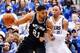 Apr 26, 2014; Dallas, TX, USA; San Antonio Spurs forward Tim Duncan (21) drives on Dallas Mavericks forward Shawn Marion (0) during the game in game three of the first round of the 2014 NBA Playoffs at American Airlines Center. Dallas won 109-108. Mandato