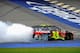 BROOKLYN, MI - AUGUST 17: Jeff Gordon, driver of the #24 Axalta Chevrolet, celebrates with a burnout after winning the NASCAR Sprint Cup Series Pure Michigan 400 at Michigan International Speedway on August 17, 2014 in Brooklyn, Michigan. (Photo by Jare