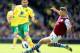 NORWICH, ENGLAND - MAY 04: Robert Snodgrass of Norwich City tangles with Nathan Baker of Aston Villa during the Barclays Premier League match between Norwich City and Aston Villa at Carrow Road on May 04, 2013 in Norwich, England. (Photo by Mark Thomps