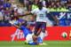 LEICESTER, ENGLAND - AUGUST 16: Romelu Lukaku of Everton is tackled by Liam Moore of Leicester City during the Barclays Premier League match between Leicester City and Everton at the King Power Stadium on August 16, 2014 in Leicester, England. (Photo by