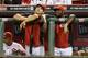 The Reds have had a lot of money stuck on the shelf this season, including Joey Votto (left) and Brandon Phillips.