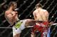 Jun 7, 2014; Albuquerque, NM, USA; Benson Henderson (red) and Rustam Khabilov (blue) fight during their lightweight bout during UFC Fight Night 42 at Tingley Coliseum. Henderson won via fourth round submission. Mandatory Credit: Joe Camporeale-USA TODAY S