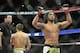 Jan 25, 2014; Chicago, IL, USA; Benson Henderson (red gloves) reacts after defeating Josh Thomson (blue gloves) during UFC on FOX 10 at the United Center. Mandatory Credit: David Banks-USA TODAY Sports