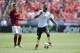 Jul 26, 2014; Denver, CO, USA; Manchester United forward Danny Welbeck (19) dribbles past AS Roma midfielder Leandro Paredes (32) in the first half against AS Roma at Sports Authority Field. Mandatory Credit: Ron Chenoy-USA TODAY Sports
