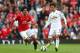 MANCHESTER, ENGLAND - AUGUST 16: Marouane Fellaini of Manchester United competes with Ki Sung-Yeung of Swansea City during the Barclays Premier League match between Manchester United and Swansea City at Old Trafford on August 16, 2014 in Manchester, Engl