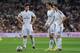 MADRID, SPAIN - AUGUST 19: Gareth Bale of Real Madrid lines up a free kick beside James Rodriguez (L) and Xabi Alonso during the Supercopa first leg match between Real Madrid and Club Atletico de Madrid at Estadio Santiago Bernabeu on August 19, 2014