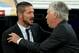 MADRID, SPAIN - AUGUST 19: head coach Diego Pablo Simeone (L) of Atletico de Madrid is greeted by head coach Carlo Ancelotti (R) of Real Madrid CF prior to start the Supercopa first leg match between Real Madrid and Club Atletico de Madrid at Estadio Sant