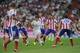 MADRID, SPAIN - AUGUST 19: Angel di Maria of Real Madrid is surrounded by Club Atletico de Madrid players during the Supercopa first leg match between Real Madrid and Club Atletico de Madrid at Estadio Santiago Bernabeu on August 19, 2014 in Madrid,