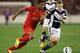 MELBOURNE, AUSTRALIA - JULY 24: Jordan Ibe (L) of Liverpool and Scott Galloway of the Victory contest for the ball during the match between the Melbourne Victory and Liverpool at Melbourne Cricket Ground on July 24, 2013 in Melbourne, Australia. (Photo