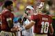 Randy Sanders, center, confers with Jameis Winston.