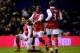 BIRMINGHAM, ENGLAND - JANUARY 01: Robin Van Persie (L) of Arsenal is congratulated by teammates Alex Song (C) and Bacary Sagna (R) after scoring the opening goal of the match during the Barclays Premier Leaue match between Birmingham City and Arsenal at