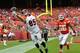 KANSAS CITY, MO - AUGUST 07: Tyler Eifert #85 of the Cincinnati Bengals attempts to pull in the ball against Derrick Johnson #56 of the Kansas City Chiefs at Arrowhead Stadium on August 7, 2014 in Kansas City, Missouri. (Photo by Peter Aiken/Getty Image