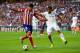 LISBON, PORTUGAL - MAY 24: Diego Costa of Club Atletico de Madrid is marshalled by Sami Khedira of Real Madrid during the UEFA Champions League Final between Real Madrid and Atletico de Madrid at Estadio da Luz on May 24, 2014 in Lisbon, Portugal. (Phot
