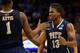 ORLANDO, FL - MARCH 22: Josh Newkirk #13 celebrates with Jamel Artis #1 of the Pittsburgh Panthers in the first half while taking on the Florida Gators during the third round of the 2014 NCAA Men's Basketball Tournament at Amway Center on March 22, 2014