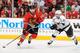 CHICAGO, IL - MAY 18: Patrick Sharp #10 of the Chicago Blackhawks grabs the puck in front of Slava Voynov #26 of the Los Angeles Kings in Game One of the Western Conference Final during the 2014 NHL Stanley Cup Playoffs at the United Center on May 18, 201