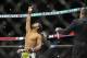Jan 25, 2014; Chicago, IL, USA; Benson Henderson (red gloves) before his fight with Josh Thomson (not pictured) during UFC on FOX 10 at the United Center. Mandatory Credit: David Banks-USA TODAY Sports