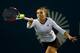 NEW HAVEN, CT - AUGUST 19: Simona Halep of Romania returns a shot to Magdalena Rybarikova of Slovakia during the Connecticut Open at the Connecticut Tennis Center at Yale on August 19, 2014 in New Haven, Connecticut. (Photo by Elsa/Getty Images)
