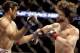 Jan 15, 2014; Duluth, GA, USA; Beneil Dariush (blue gloves) fights Charlie Brenneman (red gloves) during UFC Fight Night at Gwinnett Center. Dariush won. Mandatory Credit: Joshua S. Kelly-USA TODAY Sports