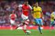 LONDON, ENGLAND - AUGUST 16: Alex Oxlade-Chamberlain of Arsenal takes on Joel Ward of Crystal Palace during the Barclays Premier League match between Arsenal and Crystal Palace at Emirates Stadium on August 16, 2014 in London, England. (Photo by Clive M