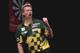 DUBAI, UNITED ARAB EMIRATES - MAY 29: Simon Whitlock of Australia celebrates winning a point against Dave Chisnall of England during the 2014 Dubai Duty Free Darts Masters Quarter-Final match at Dubai Duty Free Tennis Stadium, Irish Village on May 29,