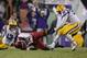 Nov 29, 2013; Baton Rouge, LA, USA; Arkansas Razorbacks quarterback Brandon Allen (10) fumbles the ball between LSU Tigers defensive end Jermauria Rasco (59) and cornerback Dwayne Thomas (13) in the fourth quarter at Tiger Stadium. LSU defeated Arkansas 3