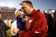 BATON ROUGE, LA - NOVEMBER 29: Head coach Les Miles (L) of the LSU Tigers talks with head coach Bret Bielema of Arkansas Razorbacks at Tiger Stadium on November 29, 2013 in Baton Rouge, Louisiana. The Tigers defeated the Razorbacks 31-27. (Photo by Chr