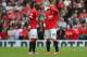MANCHESTER, ENGLAND - AUGUST 16: Wayne Rooney of Manchester United looks on with team-mate Ashley Young (L) during the Barclays Premier League match between Manchester United and Swansea City at Old Trafford on August 16, 2014 in Manchester, England. (P