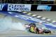 Aug 17, 2014; Brooklyn, MI, USA; NASCAR Sprint Cup Series driver Jeff Gordon burns out after winning the Pure Michigan 400 at Michigan International Speedway. Mandatory Credit: Andrew Weber-USA TODAY Sports