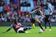 BIRMINGHAM, ENGLAND - AUGUST 23: Daryl Janmaat of Newcastle United is tackled by Aly Cissokho of Aston Villa during the Barclays Premier League match between Aston Villa and Newcastle United at Villa Park on August 23, 2014 in Birmingham, England. (Phot