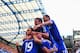 LONDON, ENGLAND - AUGUST 23: Diego Costa of Chelsea is mobbed by team mates after scoring their first goal during the Barclays Premier League match between Chelsea and Leicester City at Stamford Bridge on August 23, 2014 in London, England. (Photo by Pa