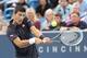 Aug 12, 2014; Cincinnati, OH, USA; Novak Djokovic returns the serve of Gilles Simon on day two of the Western and Southern Open tennis tournament at Linder Family Tennis Center. Mandatory Credit: Mark Zerof-USA TODAY Sports