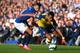 LIVERPOOL, ENGLAND - AUGUST 23: Alexis Sanchez of Arsenal competes with Kevin Mirallas of Everton during the Barclays Premier League match between Everton and Arsenal at Goodison Park on August 23, 2014 in Liverpool, England. (Photo by Clive Brunskill/G