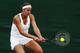 LONDON, ENGLAND - JUNE 24: Madison Keys of the United States plays a backhand during her Ladies' Singles first round match against against Monica Puig of Puerto Rico on day two of the Wimbledon Lawn Tennis Championships at the All England Lawn Tennis and