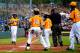 SOUTH WILLIAMSPORT, PA - AUGUST 23: Trey Hondras #24 of the Great Lakes Team from Chicago, Illinois is greeted by teammates after hitting a two RBI home run against the West Team from Las Vegas, Nevada against during the first inning of the United States