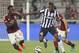 Michael Essien presses Paul Pogba