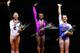 PITTSBURGH, PA - AUGUST 23: Simone Biles (center), Kyla Ross (left), and Maggie Nichols (right) pose for a photo on the podium after accepting their medals in the senior women finals during the 2014 P&G Gymnastics Championships at Consol Energy Center on